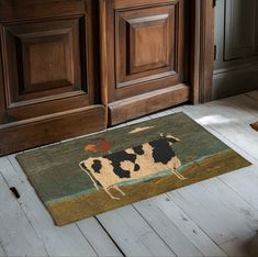 a door mat with a cow on it