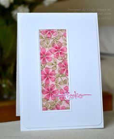 a white card with pink flowers on it