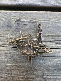 "Juhls Jewellry, Norwegian Modernist Bronze Brooch \"Tundra\" by Frank and Regine Juhls, Brutalist Style, Sculptural Jewelry, 1960s Norway Modern Sami  design.  In the 1950s, in Kautokeino, a young Danish handyman Frank Juhls met a young German girl Regine, who had taken a job as a maid with a reindeer herding family. Kautokeino was an isolated community in north of Norway, with no roads, where the Sami people still lived their traditional way of life.  The adventure began when Frank decided to repair Sami silver jewelry. This solid collectible item has  designers stamp.  Very Good Vintage condition Size approximately  L - 6.5cm (2.55\") H - 7cm (2.75\")" Brutalist Jewelry Vintage, Bronze Jewellery, Sami People, Brutalist Jewelry, Unique Shelves, Sculptural Jewelry, German Girl, Modernist Jewelry, Bronze Jewelry