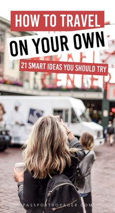 a woman standing in front of a sign that says how to travel on your own