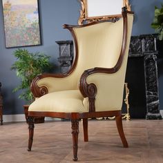 an ornate chair in front of a fireplace with a mirror on the wall above it