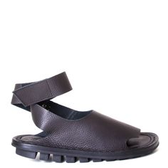 Hug is a women's all-leather sandal from Trippen. These comfy slides are made in Germany in a soft buttery, high-quality leather and stacked upon Trippen's traditional low platform rubber sole. Hug features one seamless piece of leather across the upper adding comfort to your feet and a velcro strap across the ankle for security. This shoe runs true to size. Please choose the size you normally wear. Alex is a minimalist sandal, for the summer. These will be a staple for you this season pairing w Black Leather Sole Slides, Black Synthetic Slides With Leather Sole, Leather Toe Loop T-strap Sandals With Rubber Sole, Black Leather Slip-on Footbed Sandals, Comfy Slides, Black T-strap Sandals With Rubber Sole, Leather Sandals Women, Velcro Straps, Mary Jane Sneaker