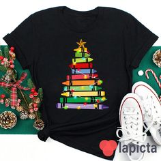 ✔️ TITTLE : Crayons Tree Colored Lights Teacher T-Shirt, Crayon Shirt, Teacher Shirt, Kindergarten Shirt, Teacher's Day Gift ✔️ IMPORTANT: Both Men and Women can we our shirts because this is unisex style t-shirts; Wash item inside out in cold water, do not bleach, do not dry clean, do not iron directly on the design. ✔️ MATERIAL DETAILS: 5.3-ounce, 100% cotton (99/1 cotton/poly (Ash) & 90/10 cotton/poly (Sport Grey); Heavyweight classic unisex tee; Taped neck and shoulders; Tearaway label ;Deco Christmas Tshirts Teacher, Multicolor Cotton Christmas Top, Summer Sportswear, Colored Lights, Kindergarten Shirts, Shirt Prints, Tree Shirt, Casual Sportswear, Design Geometric