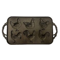 a metal tray with chickens and roosters on it's sides, in the shape of a chicken