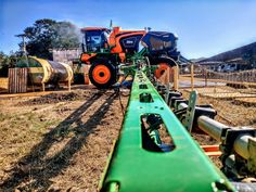 several tractors are lined up in a field