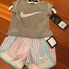 Nike Girls 2pc Set Playful Sports Cotton Sets, Pink Short Set For Playwear, Nike Short Sleeve Sets For Spring, Pink Short Sleeve Sports Set, Nike Cotton Playtime Sets, Nike Summer Playwear Sets, Nike Sports Sets For Summer, Playful Nike Sports Sets, Nike Sporty Sets For Playtime