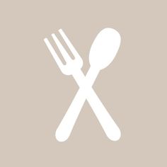 a white fork and knife icon on a gray background