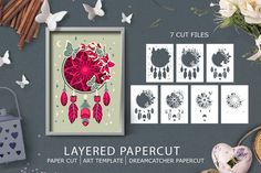 paper cut art templates with flowers, butterflies and other crafting supplies on grey background