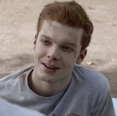 a young man with blood all over his face