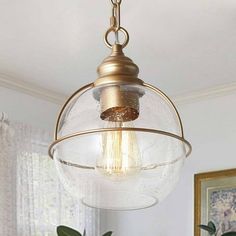 a light fixture hanging from the ceiling in a living room