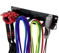 an assortment of lanyards and straps hanging on a hook with hooks for storage