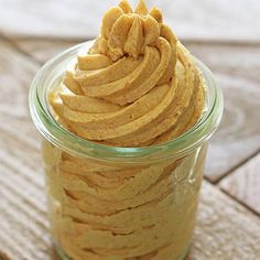 a glass jar filled with whipped cinnamon pumpkin butter