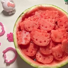 the watermelon is cut into pieces and ready to be put in the bowl