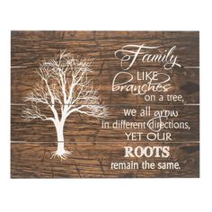 a wooden sign that says family like branches on a tree, we all carry in different directions yet our roots remain the same