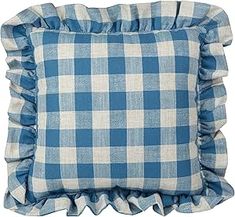 a blue and white checkered pillow with ruffled edges