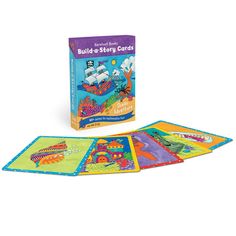 the build - a - story cards are in front of an open book