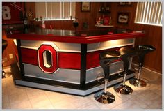 a bar with two stools in front of it and the number 0 on the counter