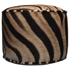 a zebra print ottoman cover on a white background