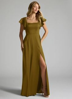 a woman in a long dress with a slit