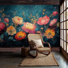 a chair sitting on top of a rug in front of a wall with flowers painted on it