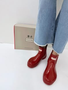 Hunter Women's Original Gloss Chelsea Boots Military Red WFS2078RGL MLR The Hunter Original Gloss Chelsea is ready for rain. Each boot is handcrafted from natural rubber and vulcanised for superior protection. Retaining the iconic features of the traditional Chelsea, it features an elasticated-gussets and has a nylon pull tab make for easy wear. Size/Fit Summary: True to size, Regular fit which features new engineered improvements. If you are in-between sizes or want to wear a thick sock, it is Rubber Boots Aesthetic, Outfits With Rain Boots Short, Rain Boots Aesthetic, Short Hunter Boots Outfit, Hunter Boots Outfit Fall, Hunter Boots Fashion, Rubber Boots Outfit, Hunter Rain Boots Outfit, Rain Boots Outfit