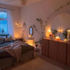 a bed room with a neatly made bed and candles