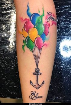 an anchor with balloons tattoo on the leg