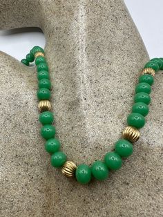 "vintage Jade beaded 18 inch necklace with 14 K gold divider beads  Gorgeous and delicate hand knotted beads All jewelry is shipped free in the US in a nice gift box.   Check out our over a THOUSAND great reviews This is \"fun jade\" Color enhanced stone. Vintage 1970's re finished." Classic Necklace With Large Beads For Gift, Vintage Gold Beads Jewelry Gift, Vintage Yellow Gold Beaded Necklace, Vintage Oval Beads Necklace For Gift, Vintage Beaded Necklaces With Round Beads For Gift, Vintage Necklaces With Oval Beads For Gift, Vintage Oval Beads Necklaces For Gift, Vintage Spacer Beads Gift, Vintage Single Strand Beaded Necklace Gift