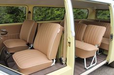 the interior of an old car with tan leather seats