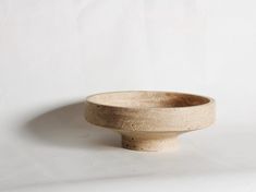 a white bowl sitting on top of a table