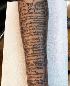 a man with a tattoo on his arm and leg that says the lord is my shepherd