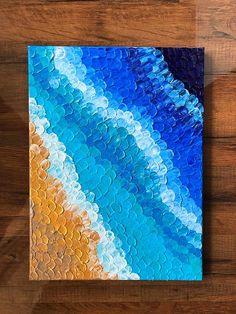 an acrylic painting on wood that looks like it has been painted in different colors