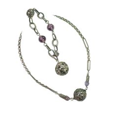 1880s Victorian gunmetal silver & amethyst necklace & bracelet set. Matching necklace & bracelet of darkened silver chain w/ links of various shapes & sizes, w/ perforated globes in a floral design; bracelet has larger amethyst globes, necklace has smaller globes w/ chain-mail caps. Entirely hand-constructed, surprisingly intact & complete. The silver has a warm & resonant patina, the amethyst globes provide a luminous contrast. A rare and singular offering. Necklace, 17"L; bracelet, 7.5"L. Design Bracelet, Chain Mail, Amethyst Necklace, Matching Necklaces, Necklace Bracelet, Vintage Necklace, Bracelet Set, Necklace Set, Necklaces Bracelets