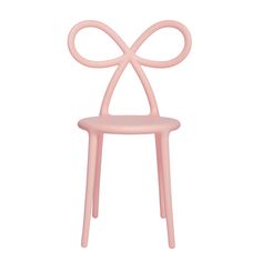 a pink chair with a bow on the back