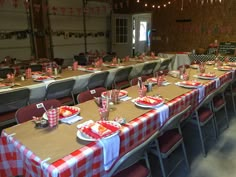 the tables are set with red and white checkered tablecloths for an event