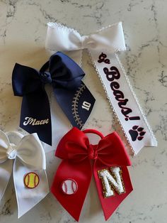 Custom personalized softball and baseball bows perfect for your athlete, the whole team, or fans!   Size: 4.5" across center of bow, 5.5" total height Please message me for team orders, which will include free shipping! Please select a main bow color, and personalization option.  Leave the name, font, and clip/pony details in the order message. Softball Hair Bows, Softball Hair, Softball And Baseball, Softball Bow, Cheer Team Gifts, Softball Bows, Softball Hairstyles, Custom Softball, Hair Ribbons