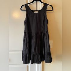 Black Flowy Mini Dress Almost Babydoll, Bought From Amazon, Still In Great Condition, Never Worn, Can Be Layered Fitted Black Sundress With Ruffles, Black Mini Sundress With Ruffles, Black Ruffled Mini Sundress, Black Sundress With Ruffles, Black Ruffled Sundress, Black A-line Sundress For The Beach, Black Cotton Sundress, Black Cotton Lined Dress, Black Cotton Dress With Ruffles