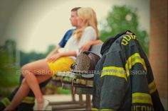 two women sitting on a bench with firefighter gear