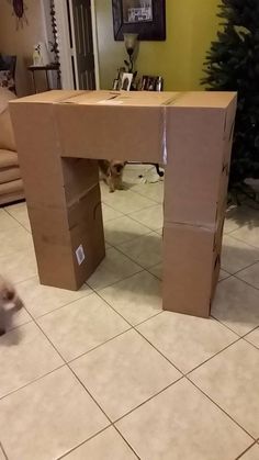 a cardboard desk sitting on top of a tiled floor