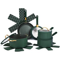 the green pots and pans are next to each other