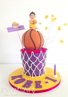 a birthday cake made to look like a basketball on top of a net with stars