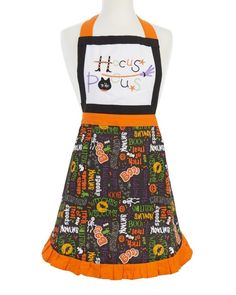 a child's halloween apron dress on a mannequin head