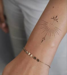 a woman's arm with a tattoo on it