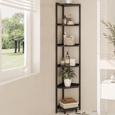 a corner shelf in the corner of a room with a potted plant on it