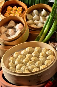 several bowls filled with dumplings and vegetables