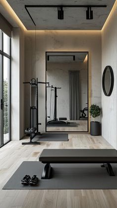 an empty gym with mirrors and exercise equipment