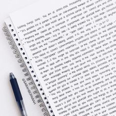 a notepad with writing on it next to a pen