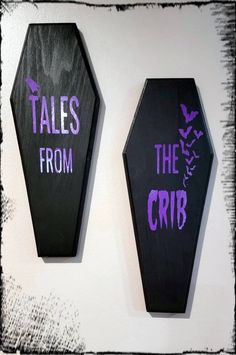 two black and purple wall hangings with the words tales from the crib on them