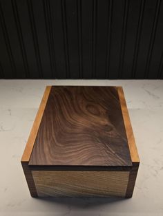 a wooden box sitting on top of a white counter