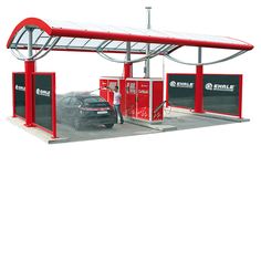 a red and white gas station with a car parked at it's pump area